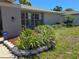 Exterior view displaying the professionally designed flower beds and landscaping at 3122 Egret Ter, Safety Harbor, FL 34695