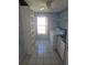 Functional laundry room featuring a washer, dryer, shelving, and a sink, perfect for household chores at 3122 Egret Ter, Safety Harbor, FL 34695