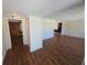 Spacious living room with wood-look floors and neutral paint at 3122 Egret Ter, Safety Harbor, FL 34695
