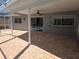 The covered brick patio looks out towards the beautiful pool at 3122 Egret Ter, Safety Harbor, FL 34695