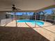 A covered patio gives way to a beautiful kidney-shaped pool at 3122 Egret Ter, Safety Harbor, FL 34695