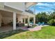 Beautiful backyard with patio, outdoor kitchen and a view of the inviting swimming pool at 315 64Th St, Holmes Beach, FL 34217