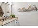 Charming bathroom with unique pelican décor, granite countertop, and modern black hardware on the faucet at 315 64Th St, Holmes Beach, FL 34217