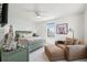 Bedroom with a large window, a fan, and a seating area is styled with a modern design at 315 64Th St, Holmes Beach, FL 34217