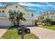 Charming yellow condo with a private balcony, well-manicured landscaping, and a welcoming curb appeal at 315 64Th St, Holmes Beach, FL 34217
