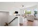 Bright, cozy living room with a large window, modern decor, and wood flooring at 315 64Th St, Holmes Beach, FL 34217