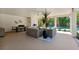 Spacious covered patio with outdoor seating, dining area, grill and view of the pool at 315 64Th St, Holmes Beach, FL 34217