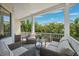 Inviting porch with comfortable seating and scenic views of surrounding greenery at 315 64Th St, Holmes Beach, FL 34217