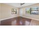 Bright living area with hardwood floors, great natural light, and ample space for versatile furniture arrangements at 3256 Roxborough Ave, Clearwater, FL 33762