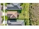 Aerial view of rooftops of homes and their backyards at 34024 White Fountain Ct, Wesley Chapel, FL 33545
