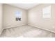 Cozy bedroom with carpet and window, providing natural light and comfortable space at 34024 White Fountain Ct, Wesley Chapel, FL 33545