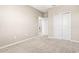 Carpeted bedroom with large closets and light walls creates a relaxing and spacious feel at 34024 White Fountain Ct, Wesley Chapel, FL 33545