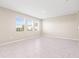 Bright, open living space featuring tile flooring and neutral walls at 34024 White Fountain Ct, Wesley Chapel, FL 33545