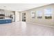 Bright living area featuring an open floor plan, tile flooring, and lots of natural light at 34024 White Fountain Ct, Wesley Chapel, FL 33545