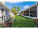 Well-maintained backyard with lush green grass and a private fence line at 3627 Cypress Meadows Rd, Tampa, FL 33624