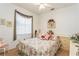 Comfortable bedroom featuring a floral-themed decor, soft natural light, and a serene ambiance at 3627 Cypress Meadows Rd, Tampa, FL 33624