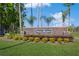 Stone community sign for Cypress Meadows, a deed-restricted community, set among landscaped greenery at 3627 Cypress Meadows Rd, Tampa, FL 33624