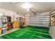 Spacious garage with ample storage and green floor covering at 3627 Cypress Meadows Rd, Tampa, FL 33624