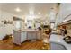 Bright and airy kitchen with wood floors, white appliances, ample counter space, and views to the living room at 3627 Cypress Meadows Rd, Tampa, FL 33624
