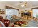 Inviting living room featuring an entertainment center, comfortable seating, and a sliding glass door at 3627 Cypress Meadows Rd, Tampa, FL 33624