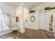 Bright living room with neutral carpet, elegant columns, and a view of the front foyer at 3627 Cypress Meadows Rd, Tampa, FL 33624