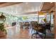 Inviting covered patio with comfortable seating, perfect for outdoor entertaining and relaxation at 3627 Cypress Meadows Rd, Tampa, FL 33624