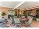 Spacious outdoor patio with multiple seating areas, perfect for entertaining and relaxing with Gathering and friends at 3627 Cypress Meadows Rd, Tampa, FL 33624