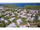 Overhead view of the community highlighting the surrounding trees, nearby lake and roadways at 39650 Us Highway 19 N # 411, Tarpon Springs, FL 34689