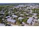 This aerial view highlights the community's peaceful setting with mature trees and well-maintained homes at 39650 Us Highway 19 N # 411, Tarpon Springs, FL 34689