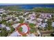 An aerial view shows the home's location, surrounded by mature trees in a well-maintained community at 39650 Us Highway 19 N # 411, Tarpon Springs, FL 34689