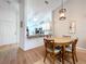 Dining area with high ceilings, wood flooring with view to the kitchen at 39650 Us Highway 19 N # 411, Tarpon Springs, FL 34689