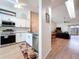 A well lit kitchen with stainless steel appliances, granite countertops and wood flooring at 39650 Us Highway 19 N # 411, Tarpon Springs, FL 34689