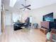 Living room with high ceilings, wood flooring, and decorative piano bar at 39650 Us Highway 19 N # 411, Tarpon Springs, FL 34689