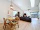 A living room with high ceilings, wood flooring and dining area at 39650 Us Highway 19 N # 411, Tarpon Springs, FL 34689