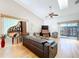 Living room with high ceilings, wood flooring and a decorative piano bar at 39650 Us Highway 19 N # 411, Tarpon Springs, FL 34689