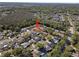 Aerial view shows a beautiful home situated in a lush, green neighborhood at 4219 Summerdale Dr, Tampa, FL 33624