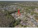 Aerial view of a tree lined neighborhood, featuring the property with lush surroundings at 4219 Summerdale Dr, Tampa, FL 33624