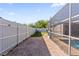 Enclosed pool patio alongside brick-paved walkway and fenced yard at 4219 Summerdale Dr, Tampa, FL 33624