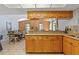 The dining area boasts granite countertops and wooden cabinets at 4219 Summerdale Dr, Tampa, FL 33624