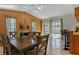 Bright dining room with wood paneling, access to the pool, and a bar area at 4219 Summerdale Dr, Tampa, FL 33624