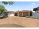 Home featuring a well-manicured lawn and a spacious driveway leading to a two-car garage at 4219 Summerdale Dr, Tampa, FL 33624
