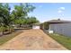 Charming single-story home with a well-kept lawn and a long driveway leading to a two-car garage at 4219 Summerdale Dr, Tampa, FL 33624