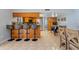 Kitchen and bar area with seating, stainless steel appliances, and open floor plan at 4219 Summerdale Dr, Tampa, FL 33624