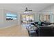 Comfortable living room featuring a sectional sofa, ceiling fan and lanai access at 4219 Summerdale Dr, Tampa, FL 33624