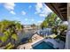 A stunning aerial view of the property with a pool, waterfront access, and private dock at 44 Martinique Ave, Tampa, FL 33606