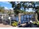Waterfront backyard featuring a boat lift and ample seating to take in the relaxing water views at 44 Martinique Ave, Tampa, FL 33606