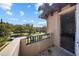 Balcony with a view of the neighborhood, featuring a stucco wall and tile floors at 44 Martinique Ave, Tampa, FL 33606