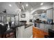 A wet bar features granite countertops, custom cabinetry, and a wine refrigerator for entertaining at 44 Martinique Ave, Tampa, FL 33606