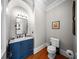 A stylish bathroom with blue vanity, marble countertop, and classic fixtures offer a blend of comfort and luxury at 44 Martinique Ave, Tampa, FL 33606