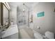Bright bathroom featuring a shower over the tub, white tiled walls and marble countertops at 44 Martinique Ave, Tampa, FL 33606